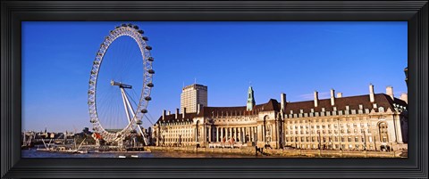 Framed Ferris wheel with buildings at the waterfront, River Thames, Millennium Wheel, London County Hall, London, England Print