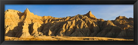 Framed Sculpted sandstone spires in golden light, Saddle Pass Trail, Badlands National Park, South Dakota, USA Print