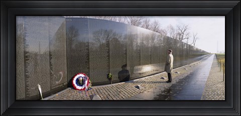 Framed Side profile of a person standing in front of a war memorial, Vietnam Veterans Memorial, Washington DC, USA Print