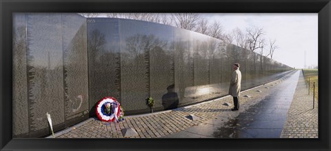Framed Side profile of a person standing in front of a war memorial, Vietnam Veterans Memorial, Washington DC, USA Print