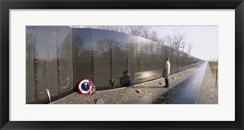 Framed Side profile of a person standing in front of a war memorial, Vietnam Veterans Memorial, Washington DC, USA Print