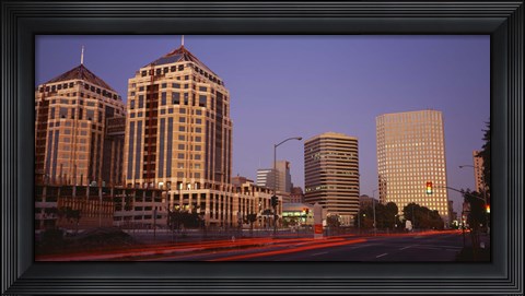Framed USA, California, Oakland, Alameda County, New City Center, Buildings lit up at night Print