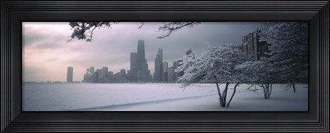 Framed Snow covered tree on the beach with a city in the background, North Avenue Beach, Chicago, Illinois, USA Print