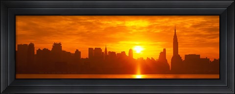 Framed Birght Orange Sky and Sun Behind the New York City Skyline Print