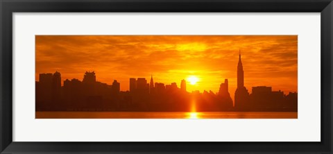 Framed Birght Orange Sky and Sun Behind the New York City Skyline Print