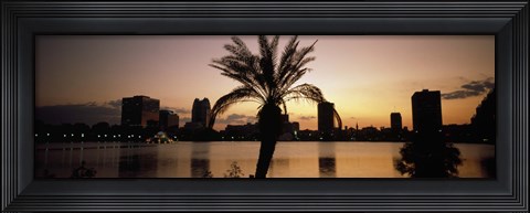 Framed Silhouette of buildings at the waterfront, Lake Eola, Summerlin Park, Orlando, Orange County, Florida, USA Print