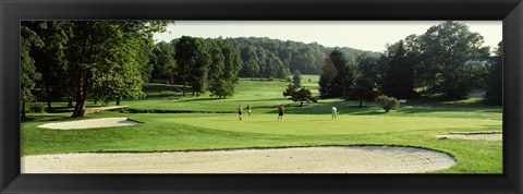 Framed Four people playing on a golf course, Baltimore County, Maryland, USA Print