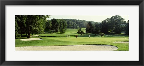 Framed Four people playing on a golf course, Baltimore County, Maryland, USA Print