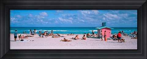 Framed Tourist on the beach, Miami, Florida, USA Print
