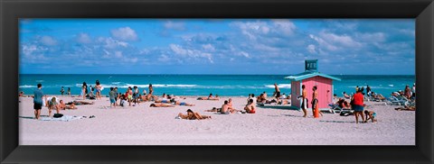 Framed Tourist on the beach, Miami, Florida, USA Print