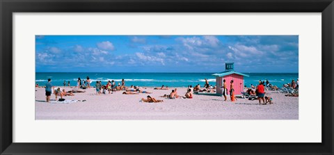 Framed Tourist on the beach, Miami, Florida, USA Print