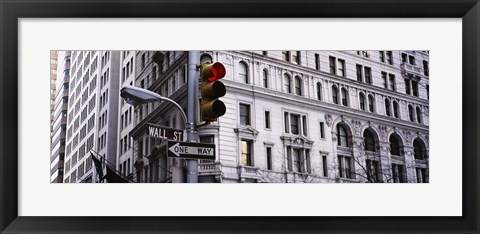 Framed Low angle view of a Red traffic light in front of a building, Wall Street, New York City Print