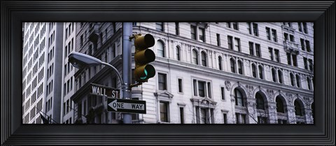 Framed Low angle view of a Green traffic light in front of a building, Wall Street, New York City Print