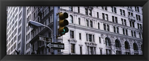 Framed Low angle view of a Green traffic light in front of a building, Wall Street, New York City Print