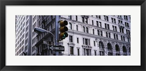 Framed Low angle view of a Green traffic light in front of a building, Wall Street, New York City Print