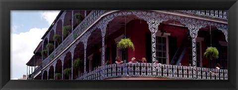 Framed People sitting in a balcony, French Quarter, New Orleans, Louisiana, USA Print