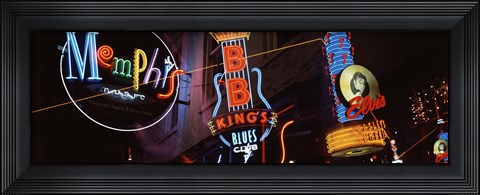 Framed Low angle view of neon signs lit up at night, Beale Street, Memphis, Tennessee, USA Print