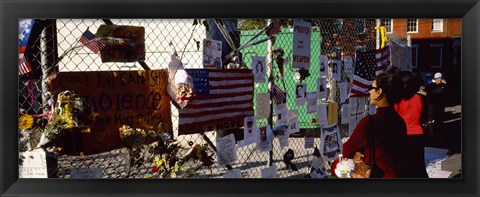 Framed Side profile of a woman standing in front of chain-link fence at a memorial, New York City, New York State, USA Print