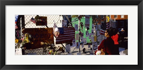 Framed Side profile of a woman standing in front of chain-link fence at a memorial, New York City, New York State, USA Print