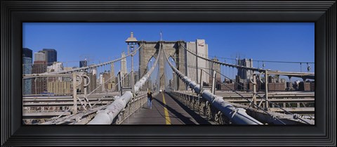 Framed Rear view of a woman walking on a bridge, Brooklyn Bridge, Manhattan, New York City, New York State, USA Print