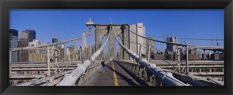 Framed Rear view of a woman walking on a bridge, Brooklyn Bridge, Manhattan, New York City, New York State, USA Print