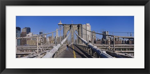 Framed Rear view of a woman walking on a bridge, Brooklyn Bridge, Manhattan, New York City, New York State, USA Print