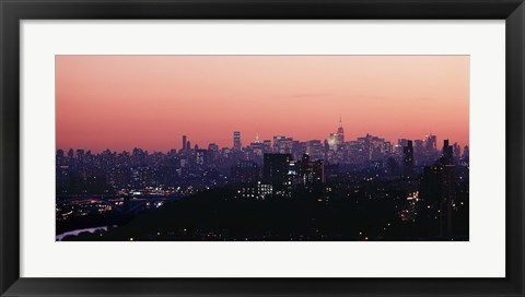 Framed High angle view of buildings lit up at dusk, Manhattan, New York City, New York State, USA Print