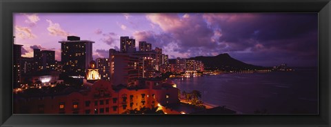 Framed Buildings lit up at dusk, Waikiki, Oahu, Hawaii, USA Print