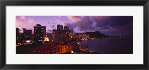 Framed Buildings lit up at dusk, Waikiki, Oahu, Hawaii, USA Print