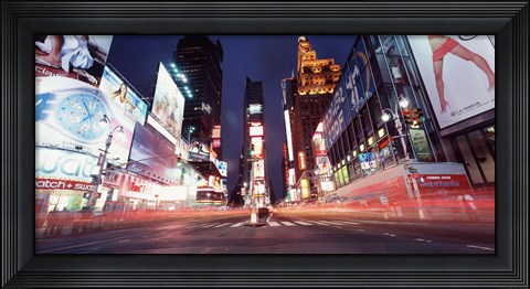 Framed Low angle view of sign boards lit up at night, Times Square, New York City, New York, USA Print