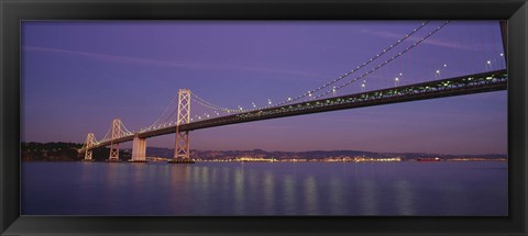 Framed Low angle view of a bridge at dusk, Oakland Bay Bridge, San Francisco, California, USA Print