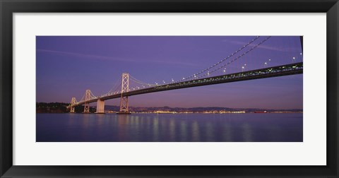 Framed Low angle view of a bridge at dusk, Oakland Bay Bridge, San Francisco, California, USA Print