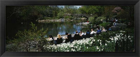 Framed Group of people sitting on benches near a pond, Central Park, Manhattan, New York City, New York State, USA Print