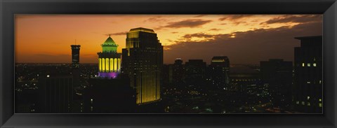 Framed High angle view of buildings lit up at dusk, New Orleans, Louisiana, USA Print