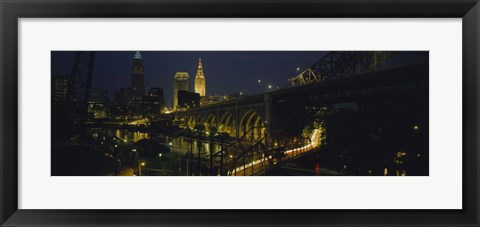 Framed Arch bridge and buildings lit up at night, Cleveland, Ohio, USA Print