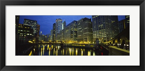 Framed Low angle view of buildings lit up at night, Chicago River, Chicago, Illinois, USA Print