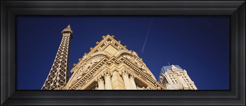 Framed Low angle view of a building in front of a replica of the Eiffel Tower, Paris Hotel, Las Vegas, Nevada, USA Print