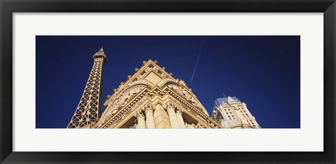 Framed Low angle view of a building in front of a replica of the Eiffel Tower, Paris Hotel, Las Vegas, Nevada, USA Print