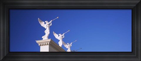 Framed Low angle view of statues on a wall, Caesars Place, Las Vegas, Nevada, USA Print