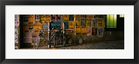 Framed Bicycle leaning against a wall with posters in an alley, Post Alley, Seattle, Washington State, USA Print