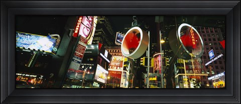 Framed Low angle view of buildings lit up at night, Times Square, Manhattan, New York City, New York State, USA Print