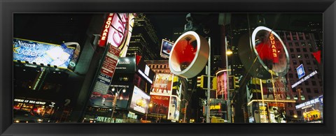 Framed Low angle view of buildings lit up at night, Times Square, Manhattan, New York City, New York State, USA Print