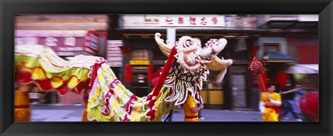 Framed Group of people performing dragon dancing on a road, Chinatown, San Francisco, California, USA Print
