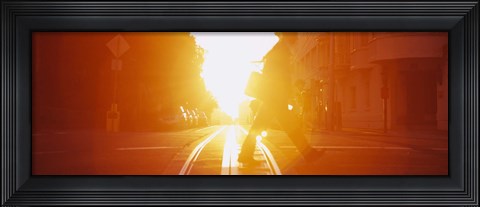 Framed Side profile of a person crossing the cable car tracks at sunset, San Francisco, California, USA Print
