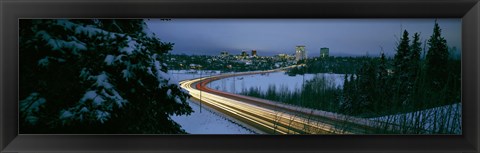 Framed Autumobile lights on busy street, distant city lights, frozen Westchester Lagoon, Anchorage, Alaska, USA. Print