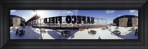 Framed Tourist sitting on a roof outside a baseball stadium, Seattle, King County, Washington State, USA Print