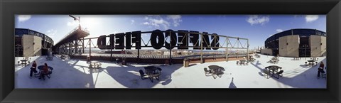 Framed Tourist sitting on a roof outside a baseball stadium, Seattle, King County, Washington State, USA Print