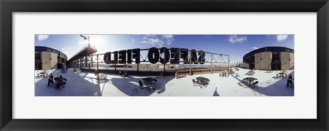 Framed Tourist sitting on a roof outside a baseball stadium, Seattle, King County, Washington State, USA Print