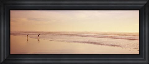 Framed Two children playing on the beach, San Francisco, California, USA Print