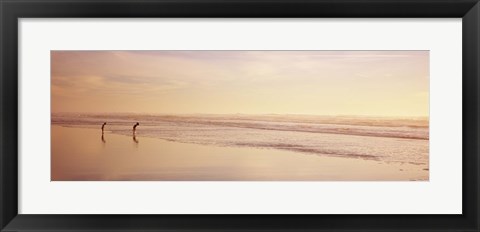Framed Two children playing on the beach, San Francisco, California, USA Print